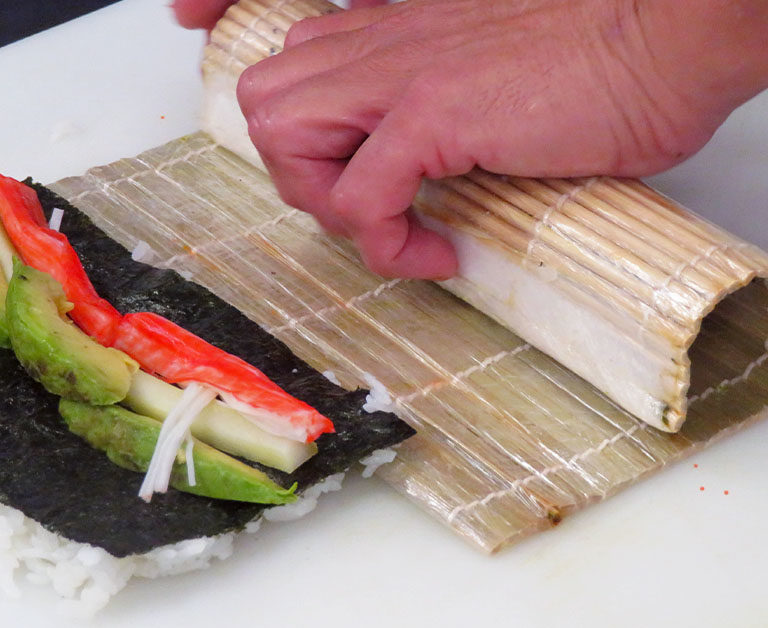Hands Rolling Sushi